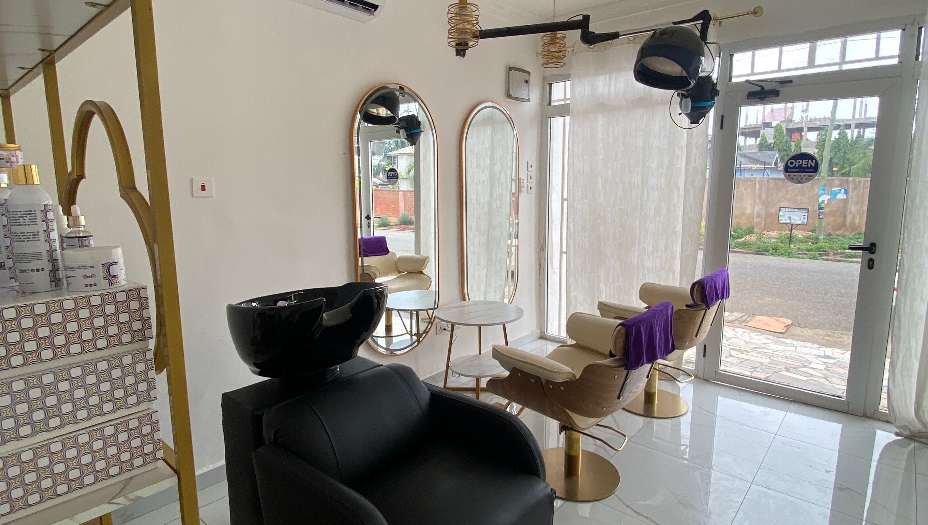 Elegant interior of Nappytalia Salon in Accra, Greater Accra Region, GH showcasing styling stations and modern decor.