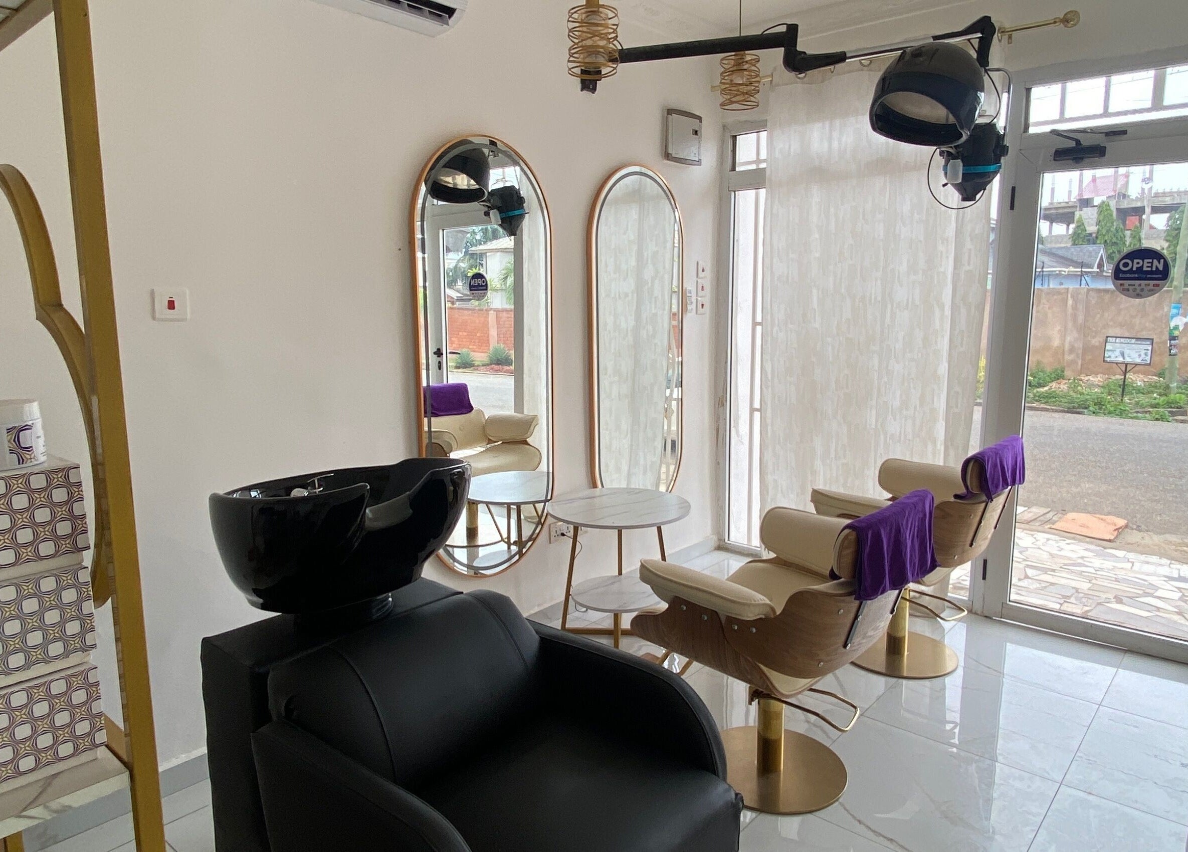 Elegant interior of Nappytalia Salon in Accra, Greater Accra Region, GH showcasing styling stations and modern decor.