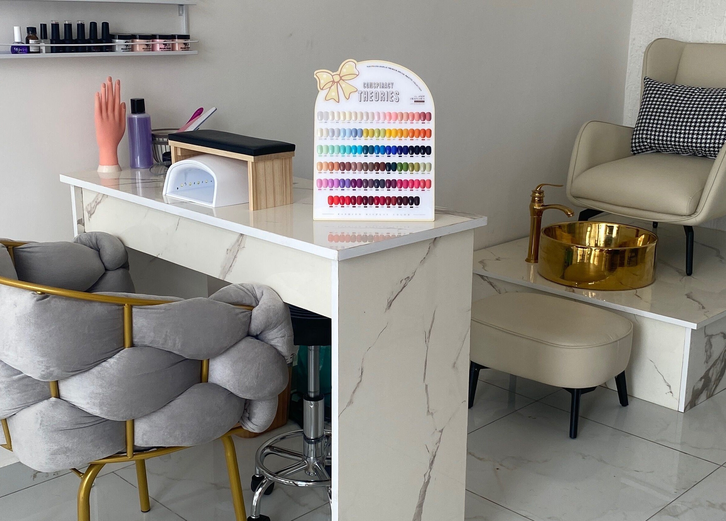 Elegant manicure station at Nappytalia Salon, Accra, Greater Accra Region, GH, featuring chic seating and polish display.