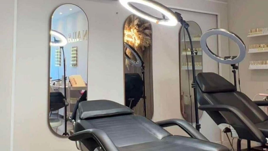 Beauty By Ang studio in Plymouth, England, GB showing a modern treatment room with comfortable chairs and mirrors.