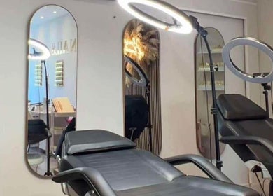 Beauty By Ang studio in Plymouth, England, GB showing a modern treatment room with comfortable chairs and mirrors.