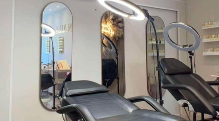 Beauty By Ang studio in Plymouth, England, GB showing a modern treatment room with comfortable chairs and mirrors.