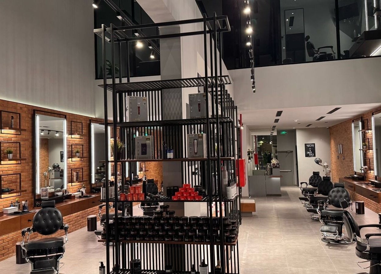 Interior of D Van Barbershop in Riyadh with sleek chairs and modern decor.