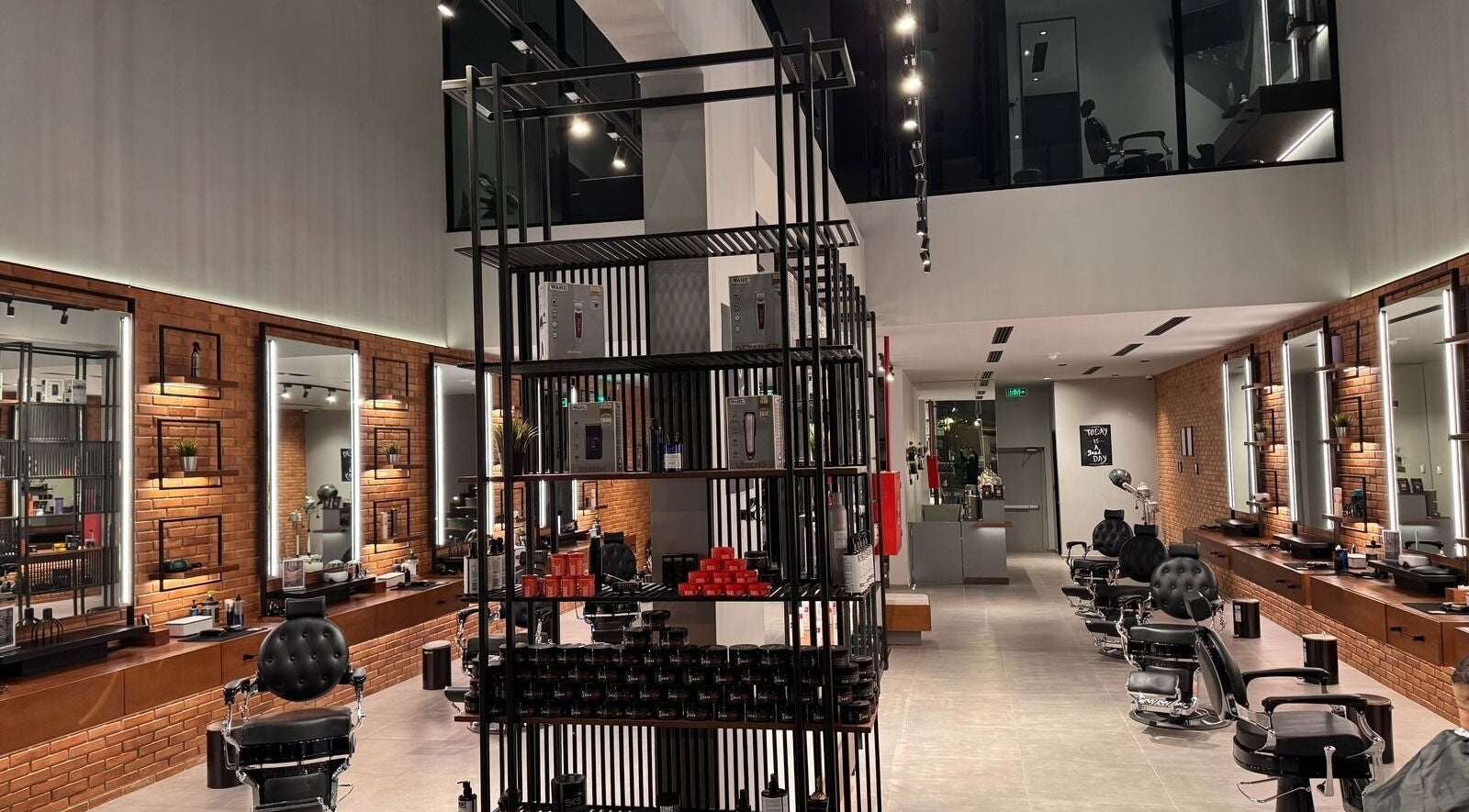 Interior of D Van Barbershop in Riyadh with sleek chairs and modern decor.