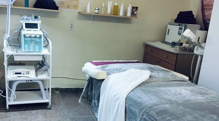 Relaxing treatment room at Angelite Esthetics, featuring modern equipment. Located in Toronto, Ontario, CA.