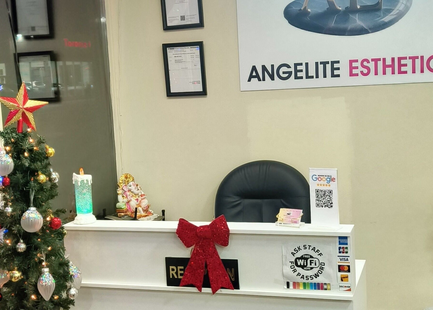 Reception area at Angelite Esthetics, Toronto, Ontario, CA, adorned with a festive tree and decor.