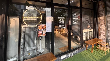 Entrance of B&G by Brew&Groom in Gombak, Kuala Lumpur, showcasing modern barbershop and cafe vibe.