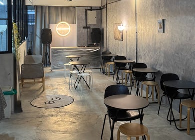 Stylish interior of B&G by Brew&Groom, barbershop cafe in Kuala Lumpur, with modern seating and ambient lighting.