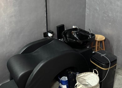 Luxurious wash station at B&G by Brew&Groom, Barbershop Cafe Gombak, Kuala Lumpur, MY with black sink and chair.