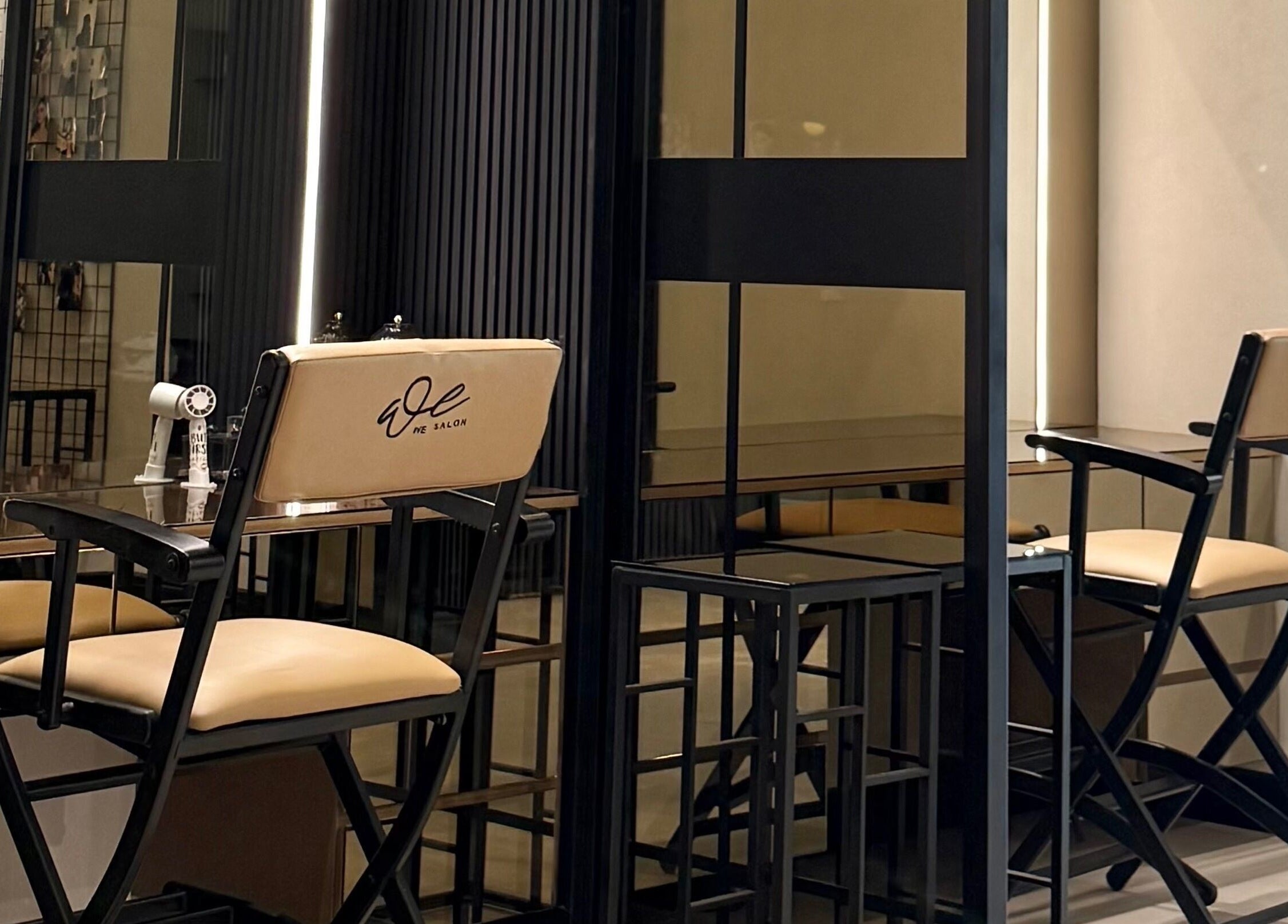 Elegant interior of We Salon in Riyadh, showcasing stylish chairs and mirrors. Riyadh Province, SA.