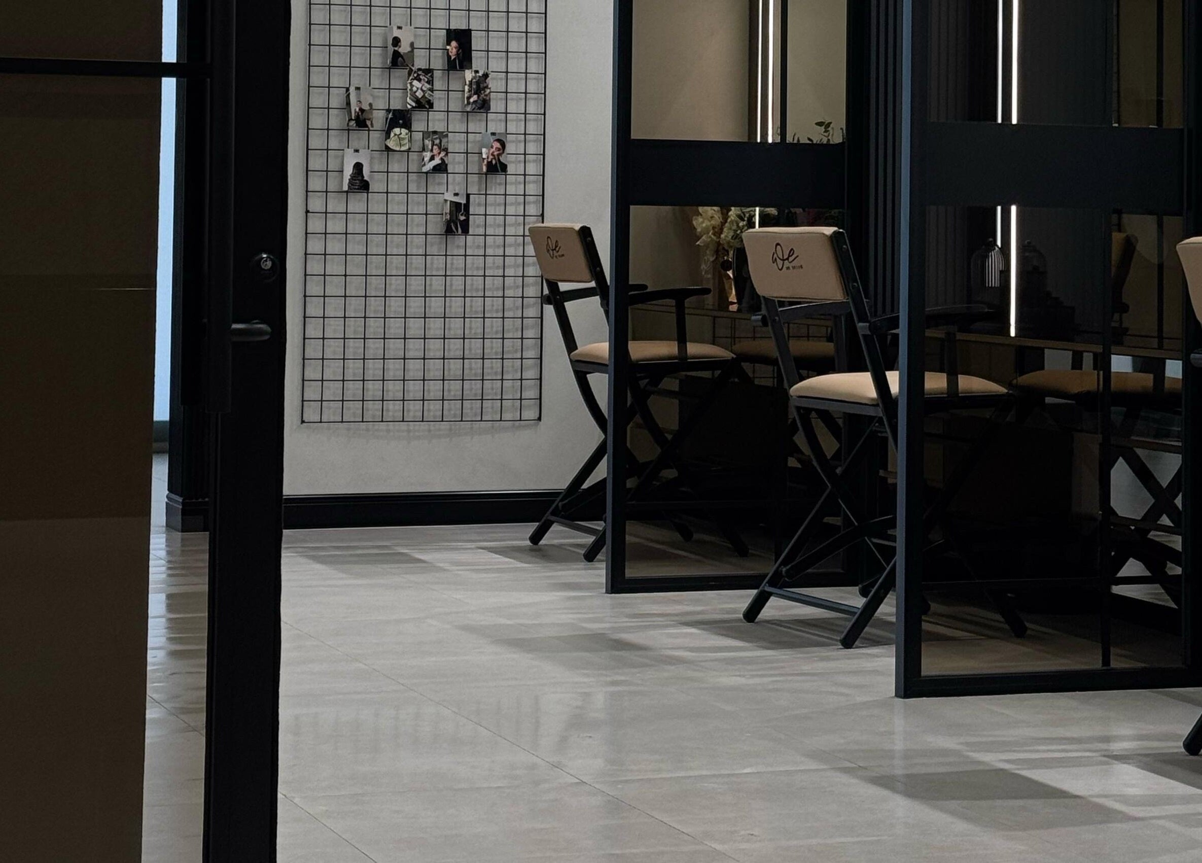 Sophisticated interior of We Salon in Riyadh, Riyadh Province, SA, showcasing stylish decor and seating.