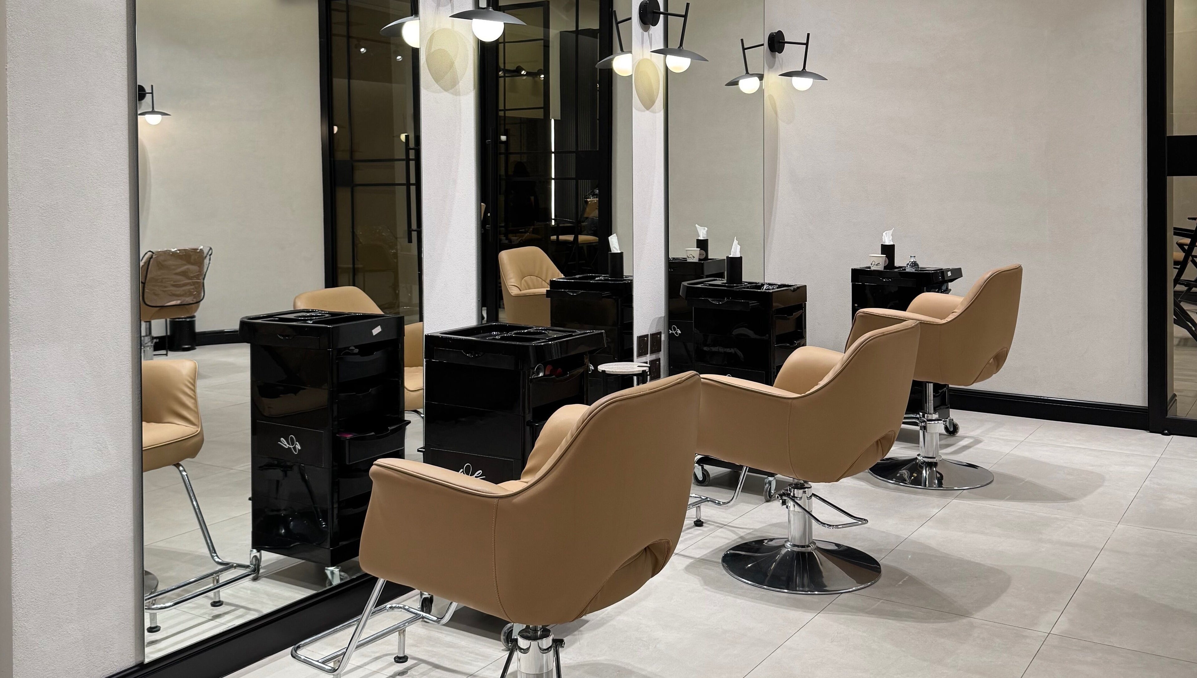 Sleek salon chairs in We Salon's modern interior, Riyadh, Riyadh Province, SA.