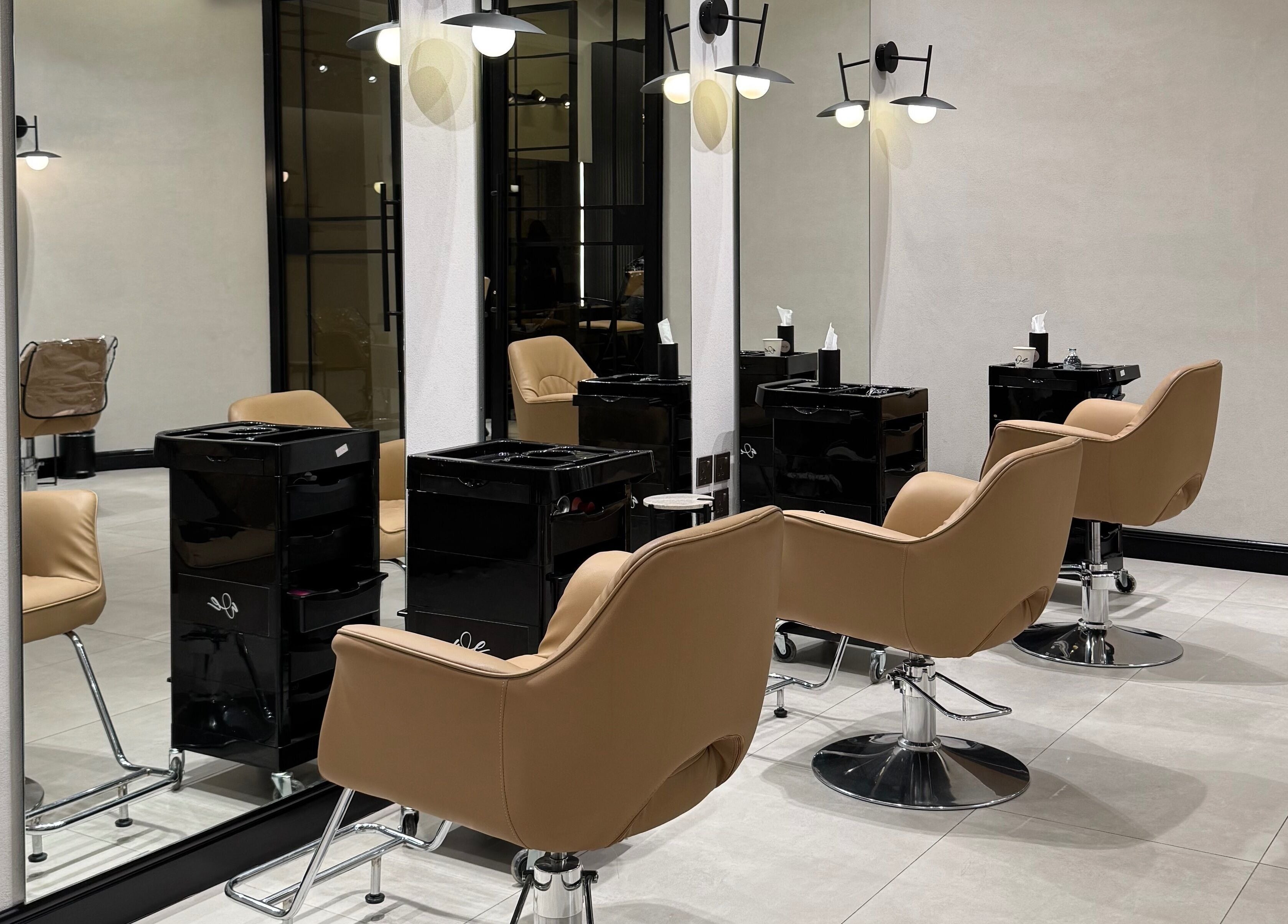 Sleek salon chairs in We Salon's modern interior, Riyadh, Riyadh Province, SA.