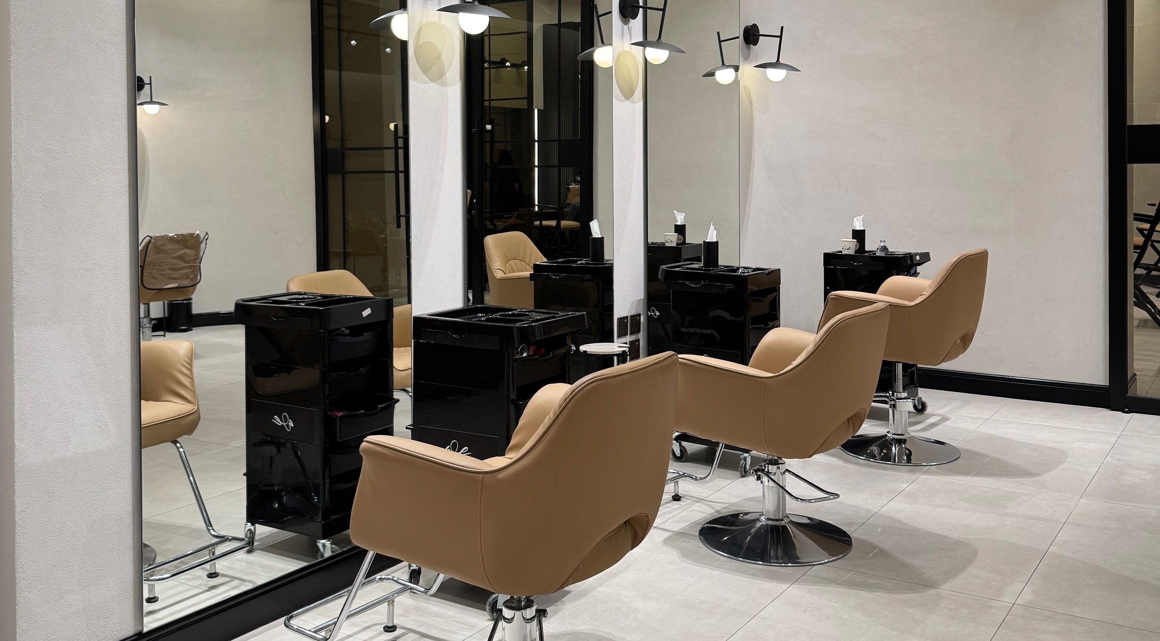 Sleek salon chairs in We Salon's modern interior, Riyadh, Riyadh Province, SA.