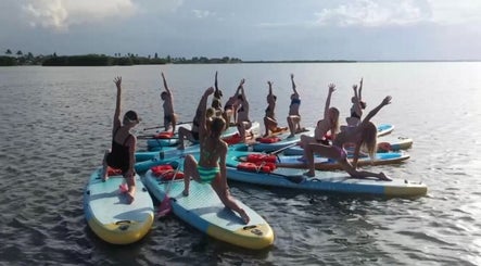 Group yoga on paddleboards at SoulVival Wellness, Merritt Island, Florida, US.