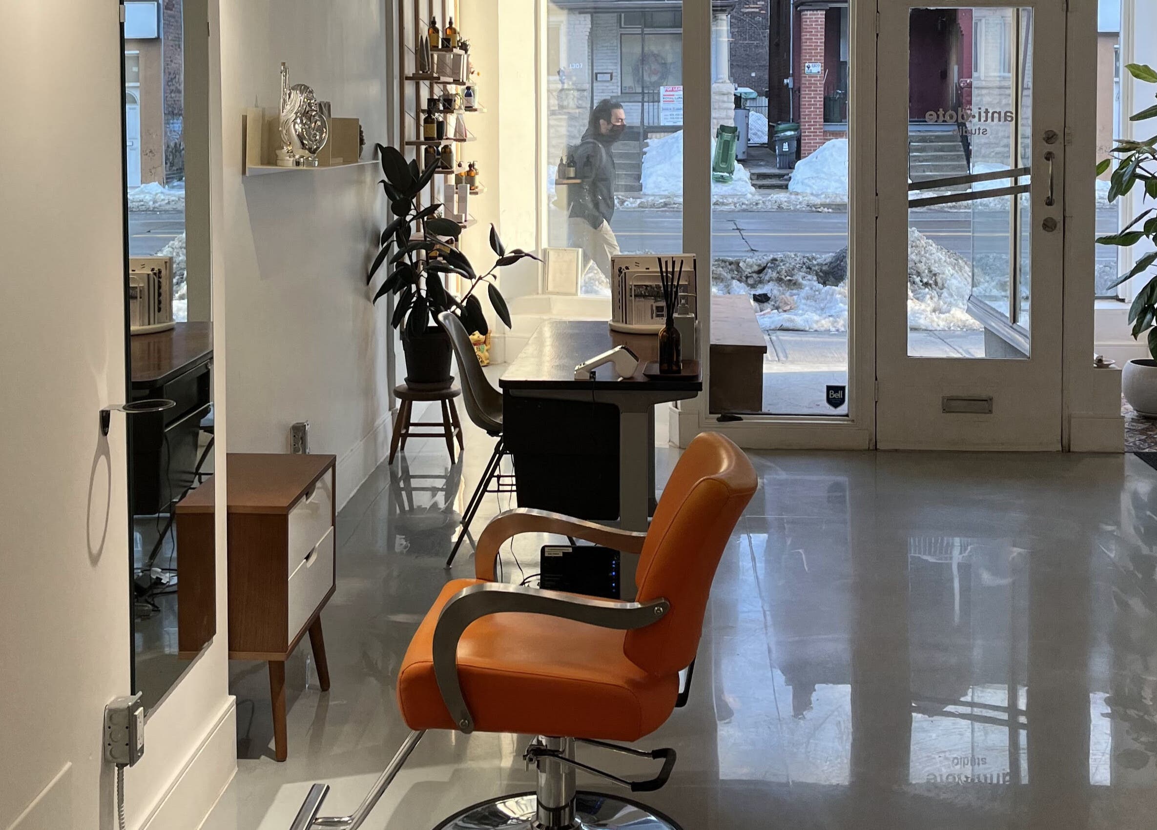 Spacious and stylish interior of Antidote Studio in Toronto, Ontario, CA, featuring modern salon chairs and decor.