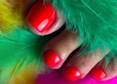 Bold red pedicure with feathers at TyNails by Tatiana Samson, Portsmouth, England, GB.