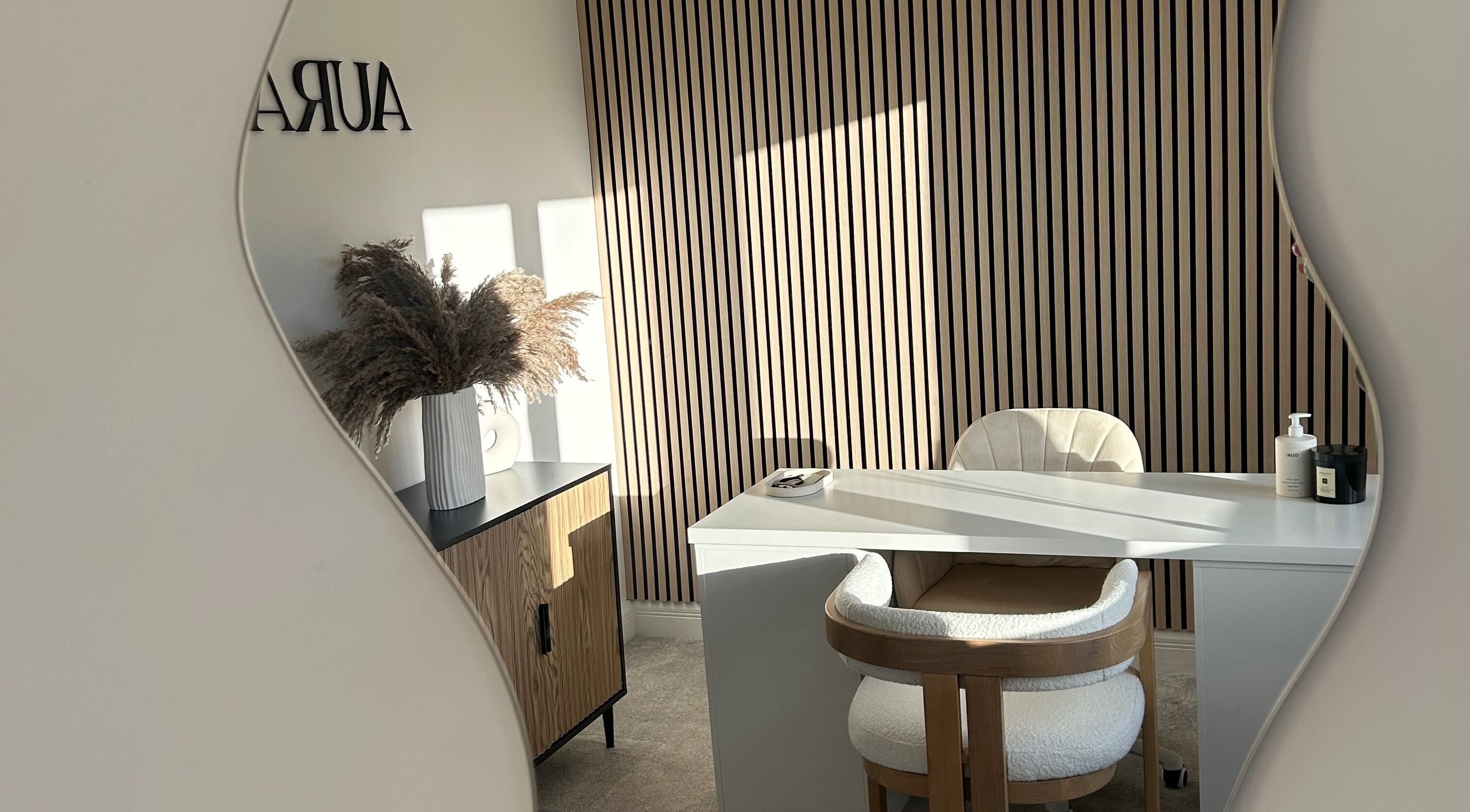 Elegant treatment room at Aura By Francesca in Sale, England showcasing a modern design with stylish decor.