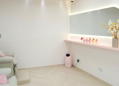 Calm spa seating area at Blinkbar at Orchard Gateway, Singapore, SG with plush chairs, soft lighting, and decor.