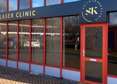Skiin Laser Clinic entrance with vibrant red decor in Peterborough, England, GB.