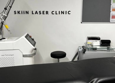 Skiin Laser Clinic treatment room in Peterborough, England, featuring advanced laser equipment and modern setup.