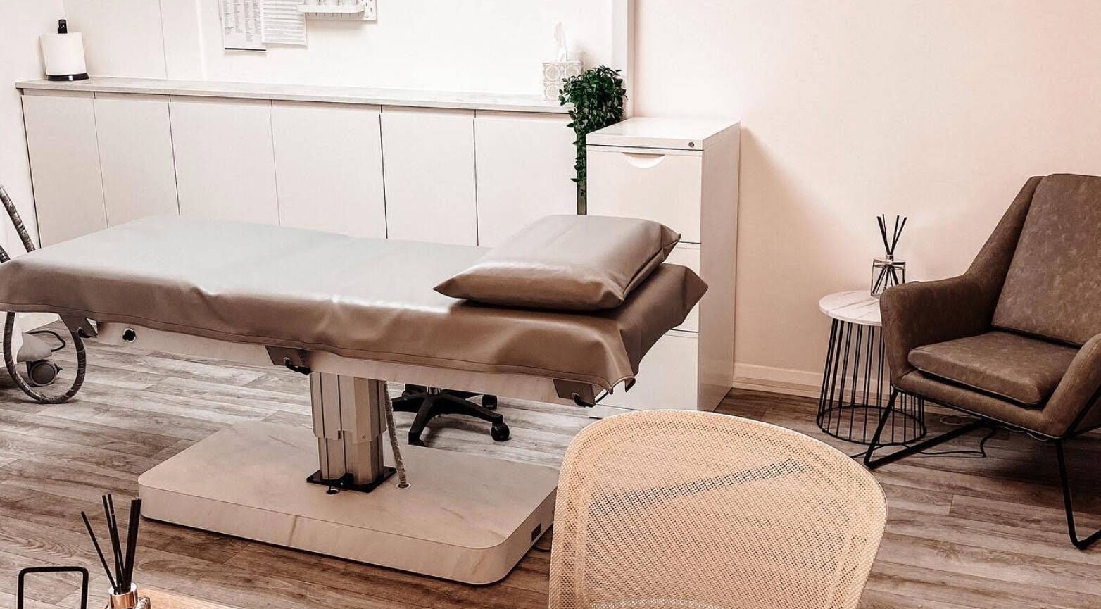 Cozy treatment room at Skiin Laser Clinic in Peterborough, England, GB showcasing a comfortable reclining chair.