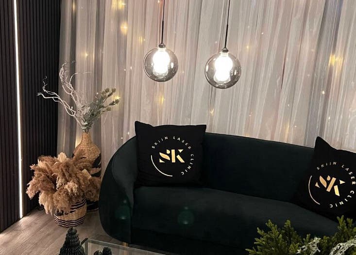 Cozy seating area at Skiin Laser Clinic, Peterborough, England, GB with modern decor and ambient lighting.
