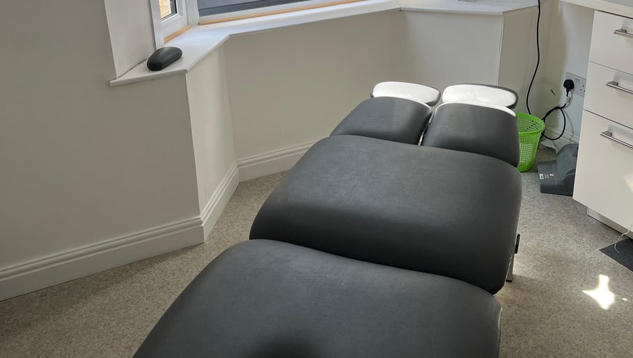 Modern therapy room at Align Enhancements, Barry, Wales, GB, featuring a comfortable treatment bed.