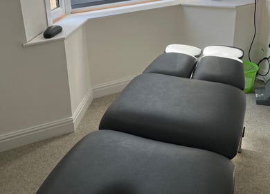 Modern therapy room at Align Enhancements, Barry, Wales, GB, featuring a comfortable treatment bed.