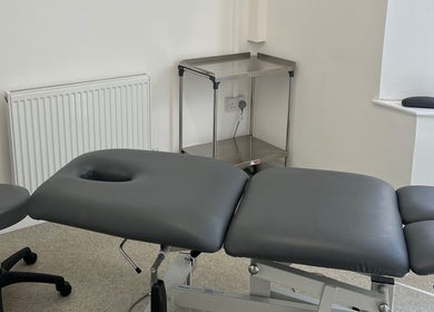 Professional treatment room at Align Enhancements, Barry, Wales, GB featuring adjustable massage table.