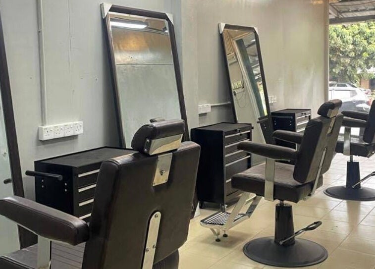 Modern barber chairs at Qnd Barbershop, Hulu Langat, Selangor, MY, offering a comfortable grooming experience.