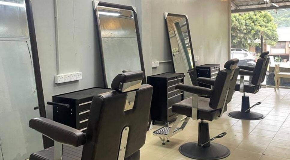 Modern barber chairs at Qnd Barbershop, Hulu Langat, Selangor, MY, offering a comfortable grooming experience.