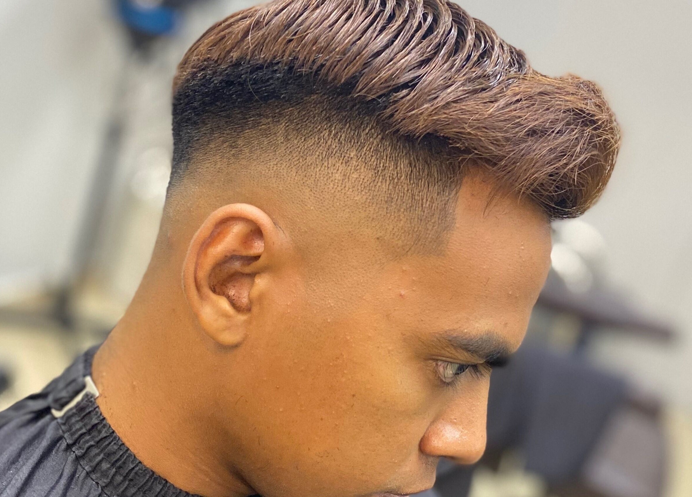 Fresh tapered haircut at Qnd Barbershop, Hulu Langat, Selangor, MY, showcasing modern barbering skills.