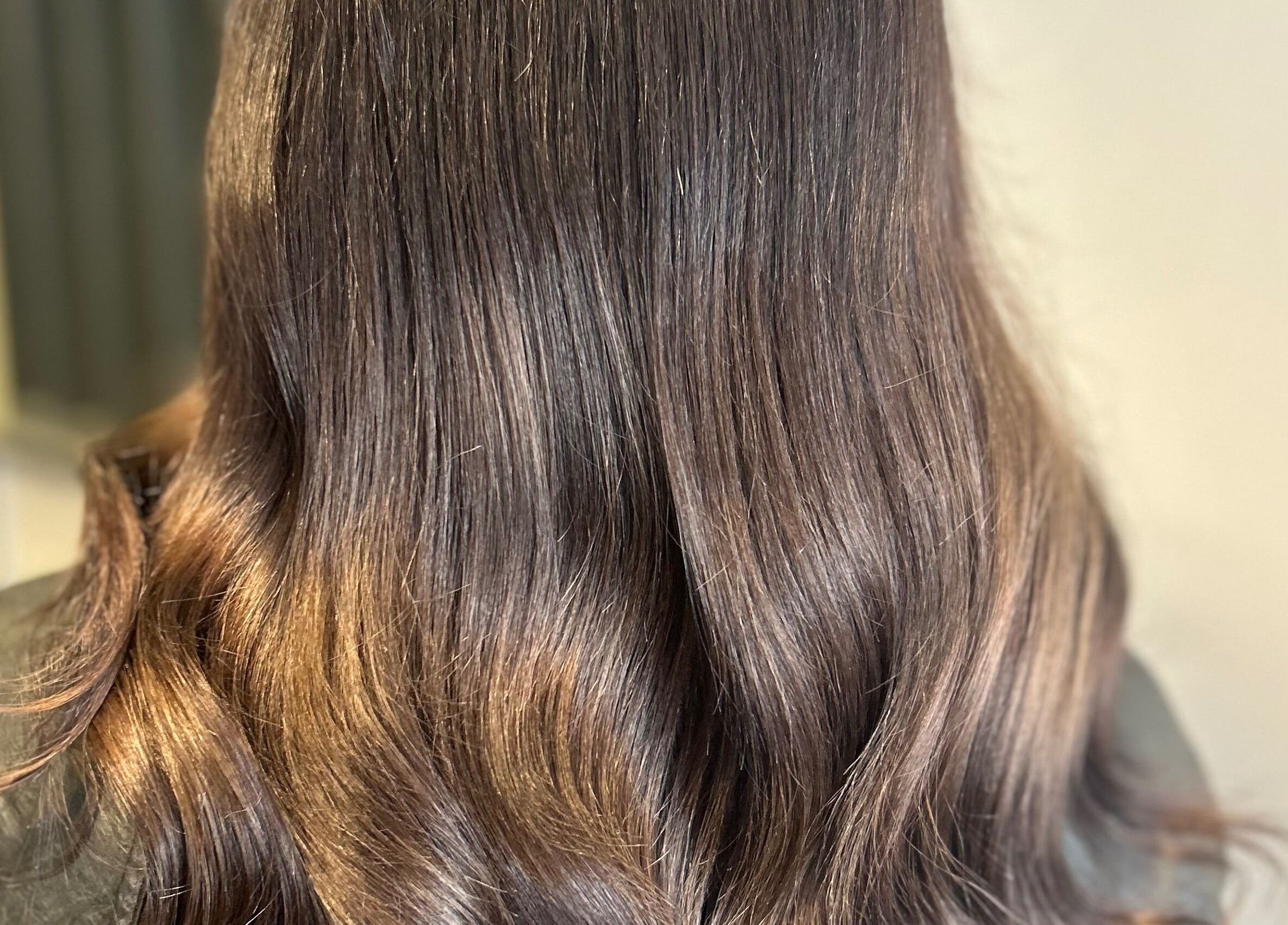 Shiny brunette waves from Caine Moore Hair in Egremont, England, GB.