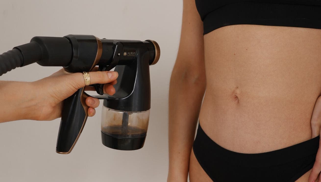 Tanning spray session at JM Sprays, CRIEFF, Scotland, GB. Enhancing skin tone with precision.