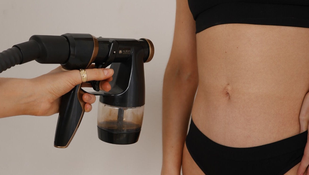 Tanning spray session at JM Sprays, CRIEFF, Scotland, GB. Enhancing skin tone with precision.