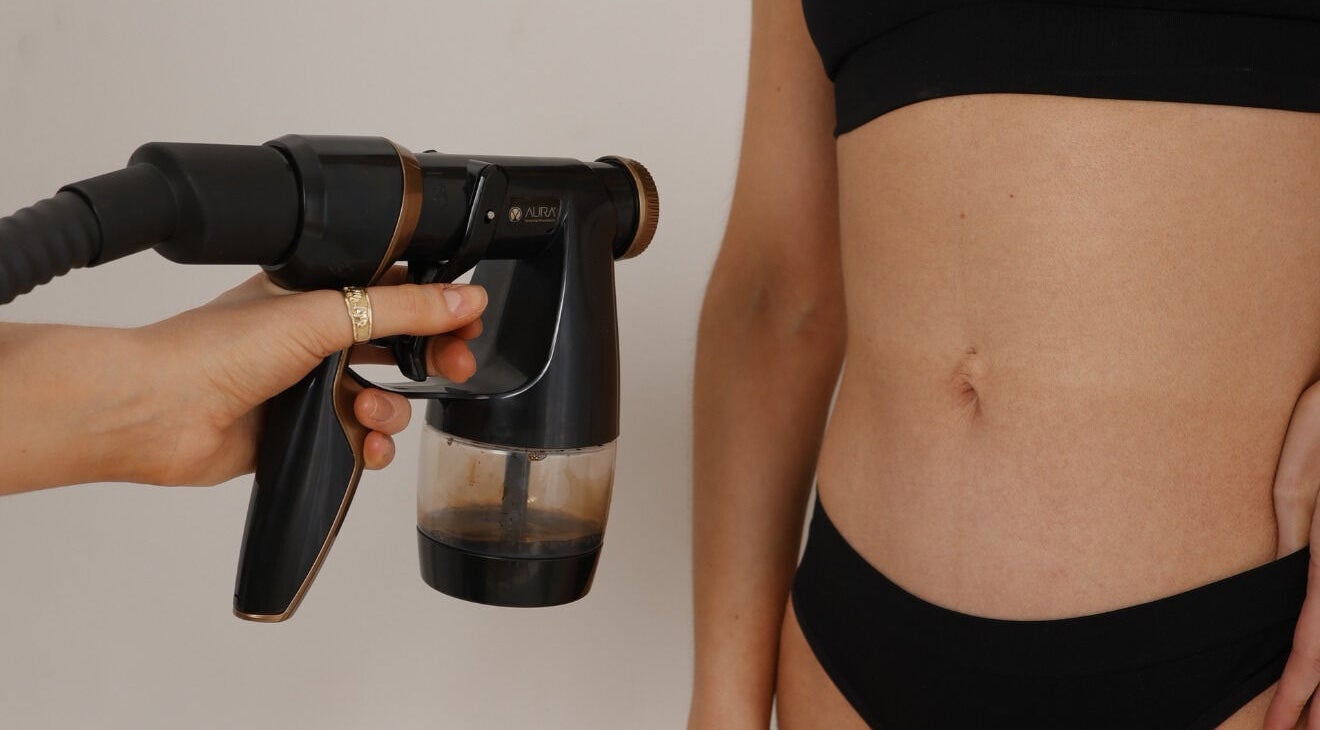 Tanning spray session at JM Sprays, CRIEFF, Scotland, GB. Enhancing skin tone with precision.