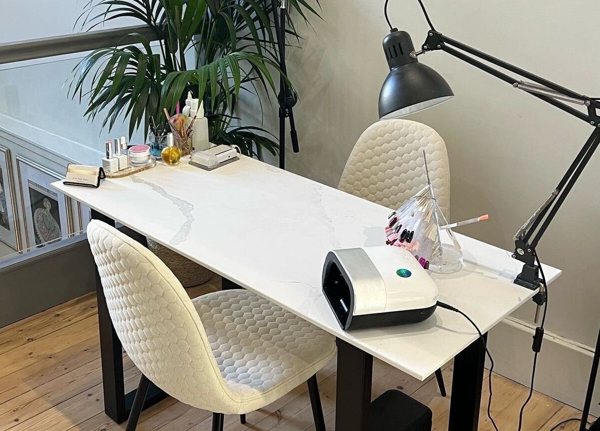 Chic nail station at Erin Rose Nails, Edinburgh, Scotland, GB. Modern design with manicure tools and plush chairs.
