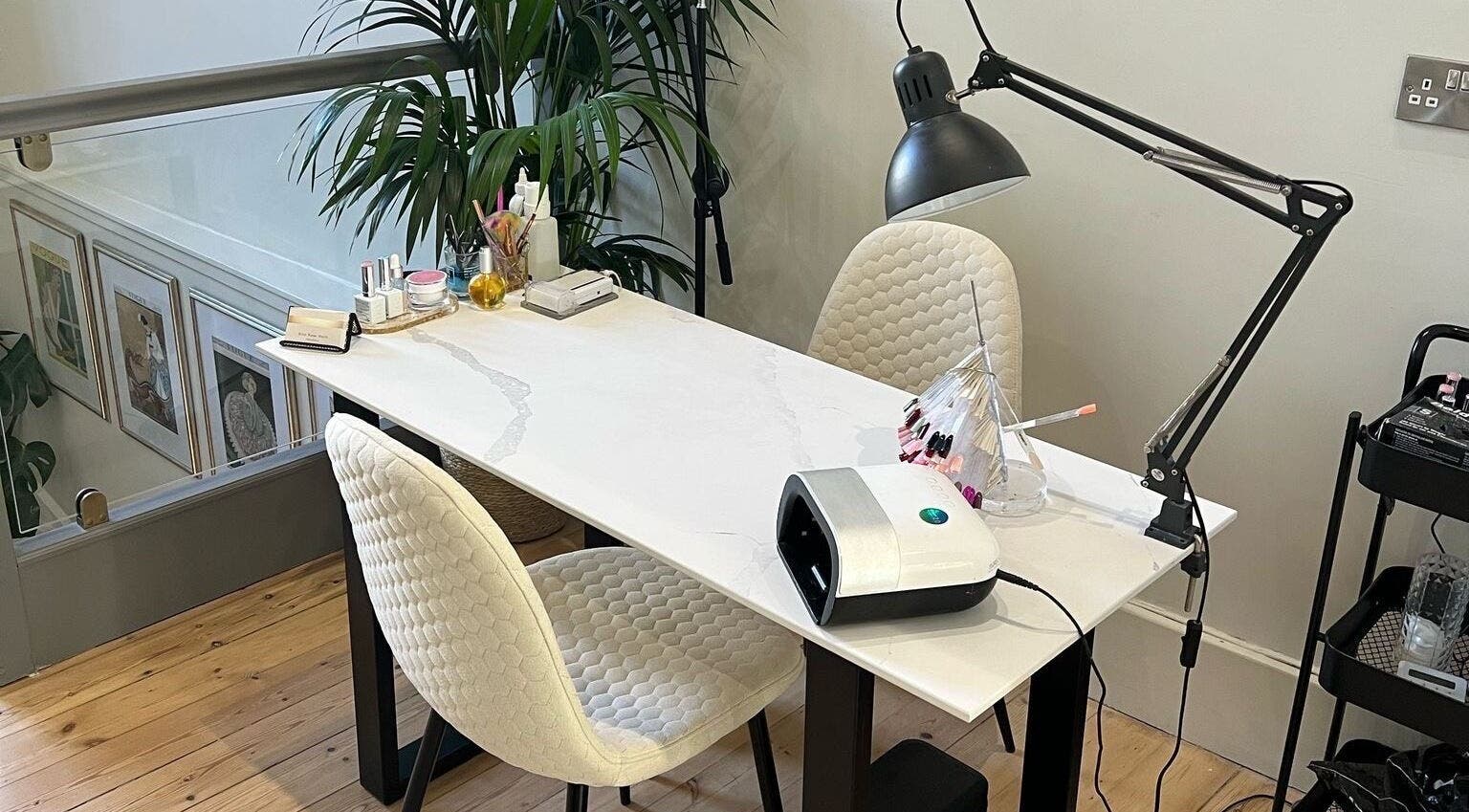 Chic nail station at Erin Rose Nails, Edinburgh, Scotland, GB. Modern design with manicure tools and plush chairs.