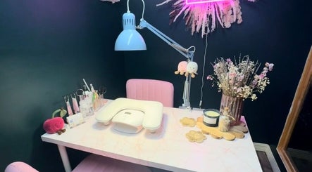 Chic nail desk setup at KB Nails Beauty, Purbrook, England, GB with pink chair and floral decor.