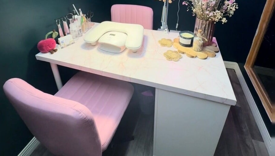 Elegant nail station at KB Nails Beauty, Purbrook, England. Features pink chairs and decor.