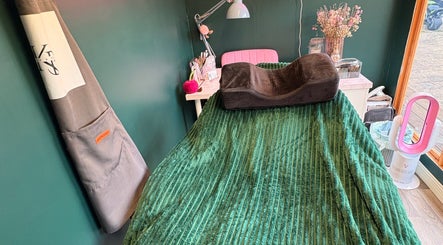 Relaxing treatment room at KB Nails Beauty, Purbrook, England, GB with green decor and cozy setup.