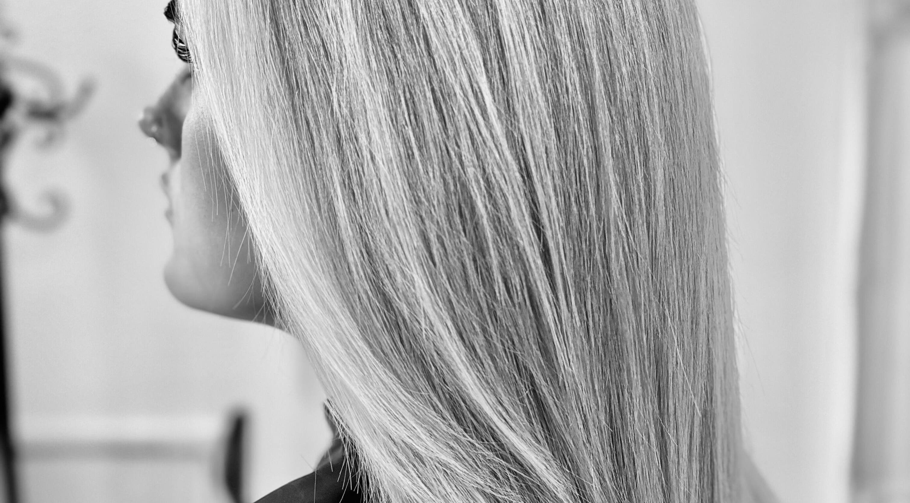 Sleek blonde hair styled perfectly at Hair Craft & Co in Torquay, England, GB.
