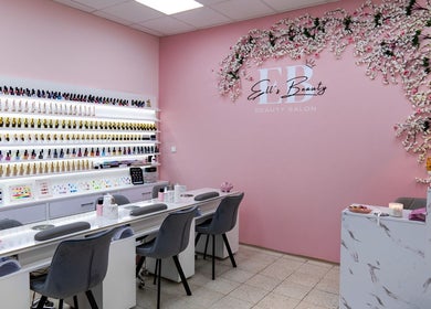 Nail service area at Ell's Beauty Salon, Jihomoravský Kraj, CZ, showcasing a wide range of nail polishes.