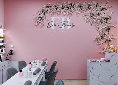 Ell's Beauty Salon in Jihomoravský Kraj features elegant pink decor and manicured stations.