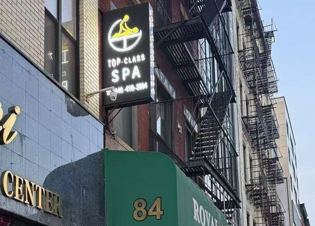 TOP-CLASS SPA signage on a building in New York, New York, US, inviting relaxation and wellness.