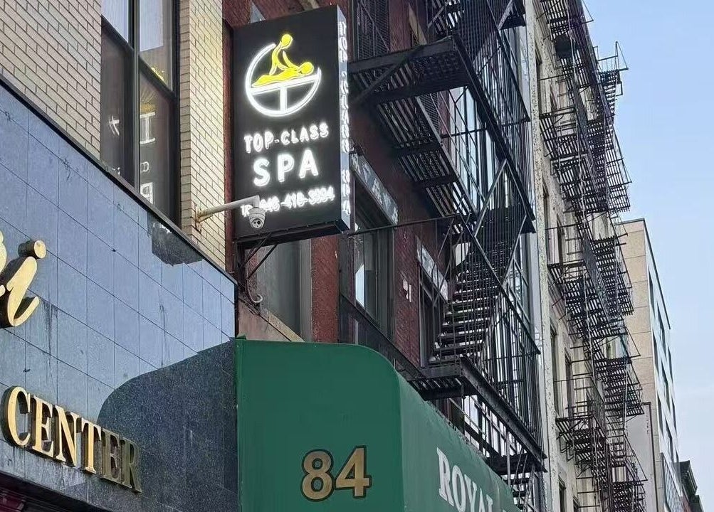 TOP-CLASS SPA signage on a building in New York, New York, US, inviting relaxation and wellness.