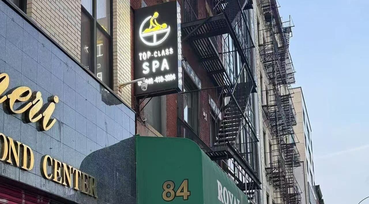 TOP-CLASS SPA signage on a building in New York, New York, US, inviting relaxation and wellness.