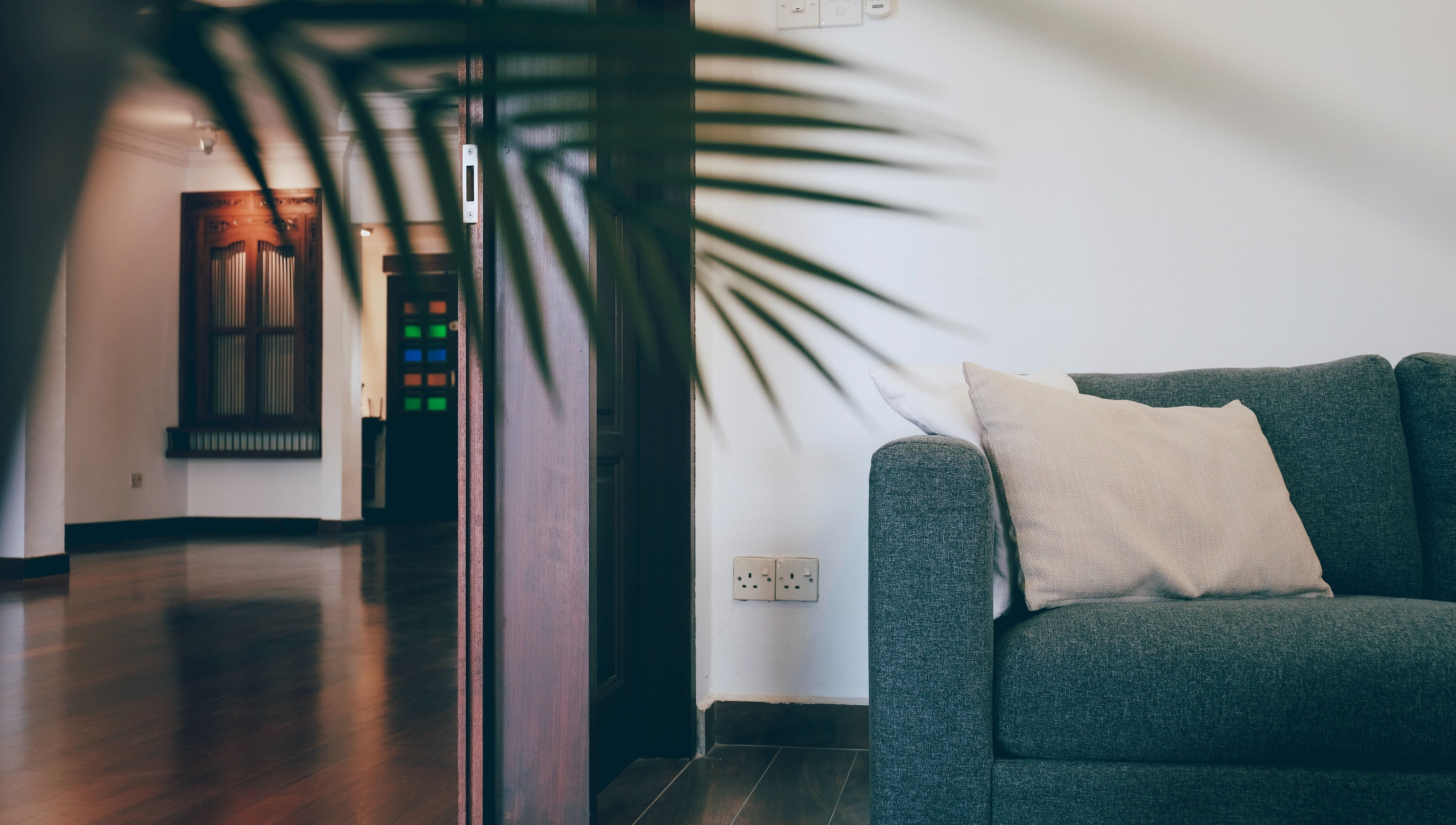 Inviting lounge at Sage Centre, Subang Jaya, Selangor, MY, featuring a cozy gray sofa and elegant decor.