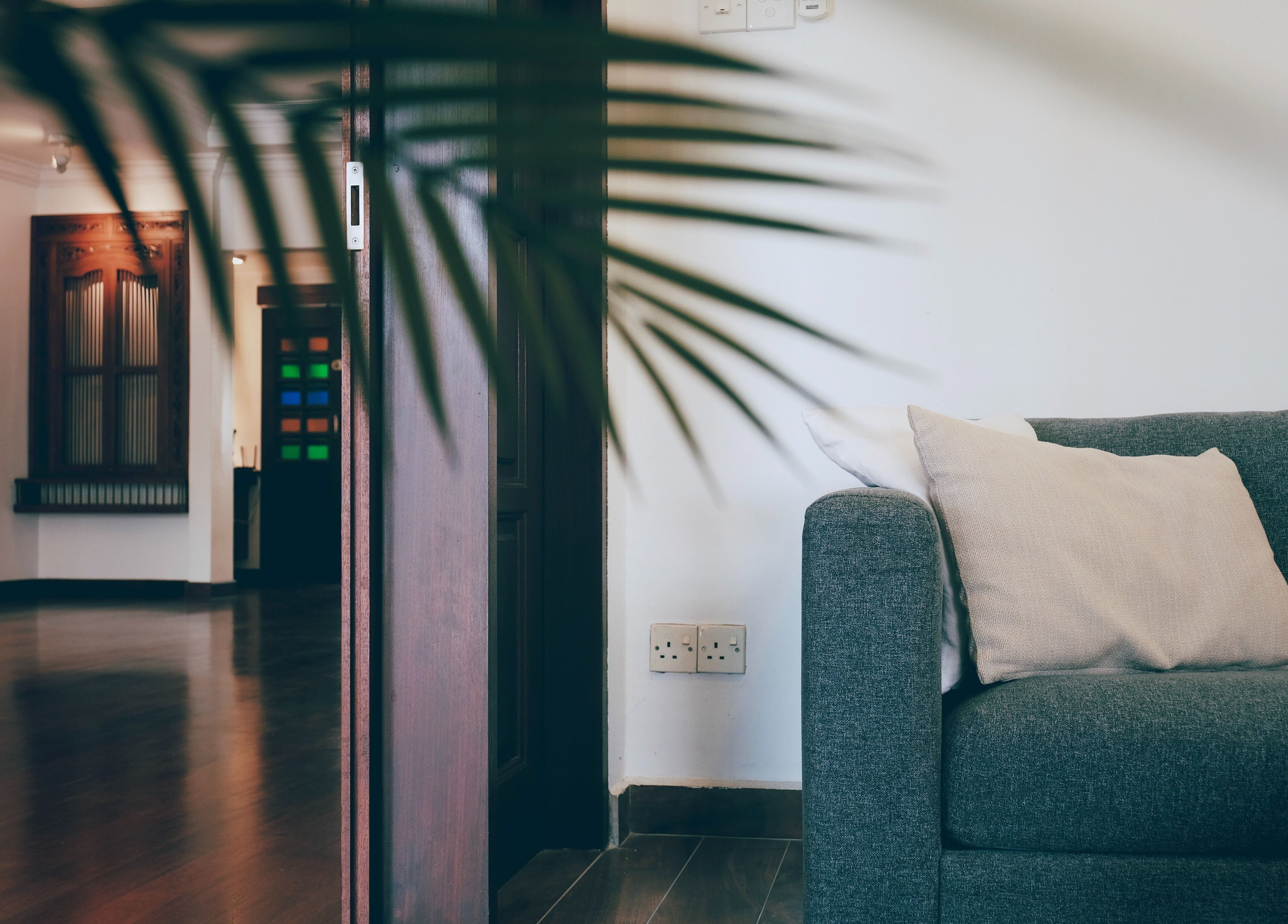 Inviting lounge at Sage Centre, Subang Jaya, Selangor, MY, featuring a cozy gray sofa and elegant decor.